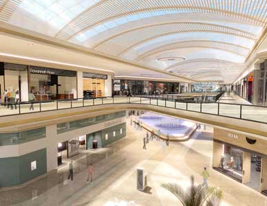 Rendering of a mall promenade with shoppers and sunlight streaming through transparent roof.