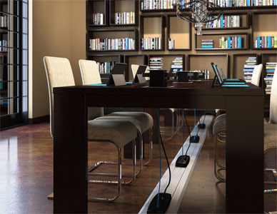Rendering of a series of library desks showing the power channel that provides electricity to the laptops on the desks.