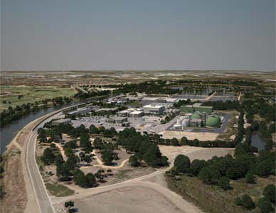 An aerial view of the proposed facility with the surrounding city visible in the distance.